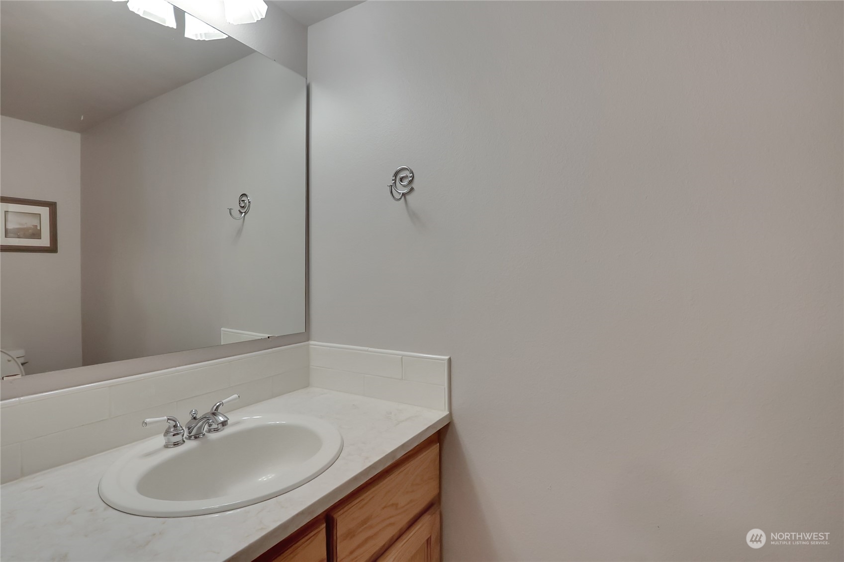 3430 201st Place Southeast Bothell, WA 98012 - Photo 17 of 32 a bathroom with a sink and a mirror