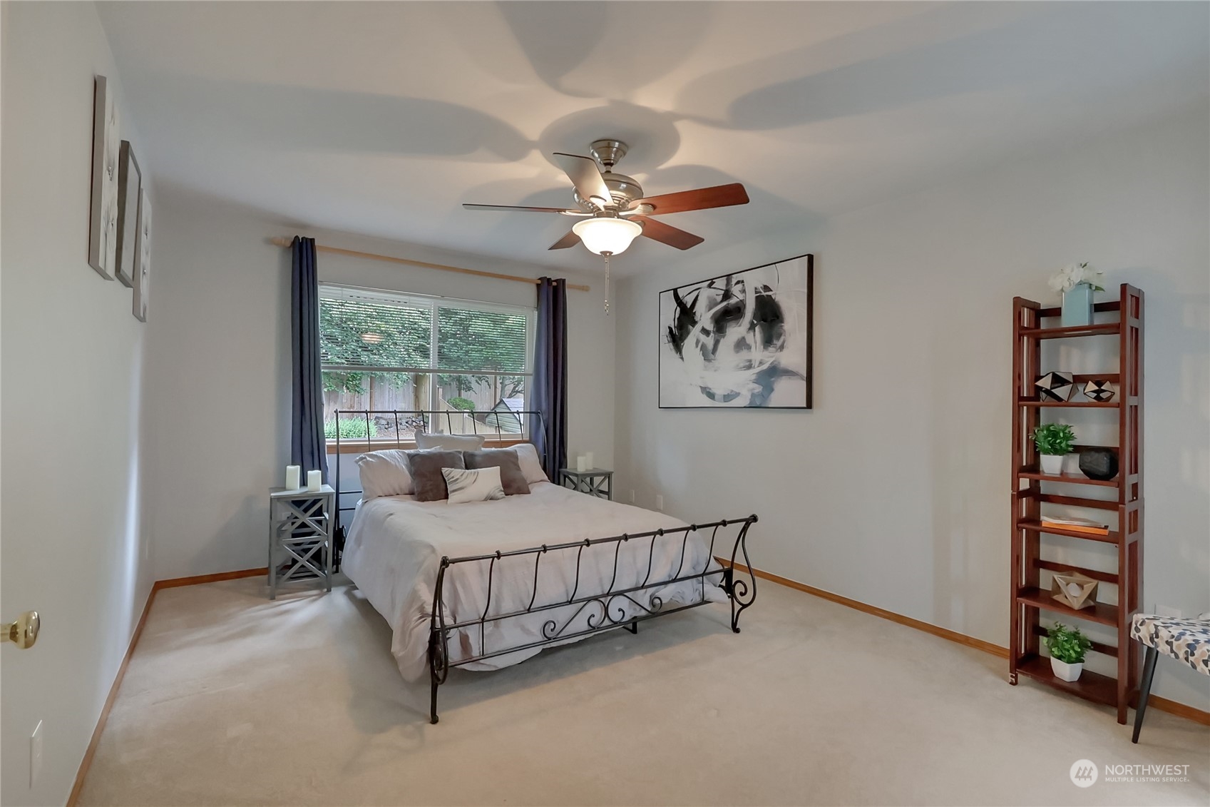3430 201st Place Southeast Bothell, WA 98012 - Photo 18 of 32 a bedroom with a bed and a chandelier