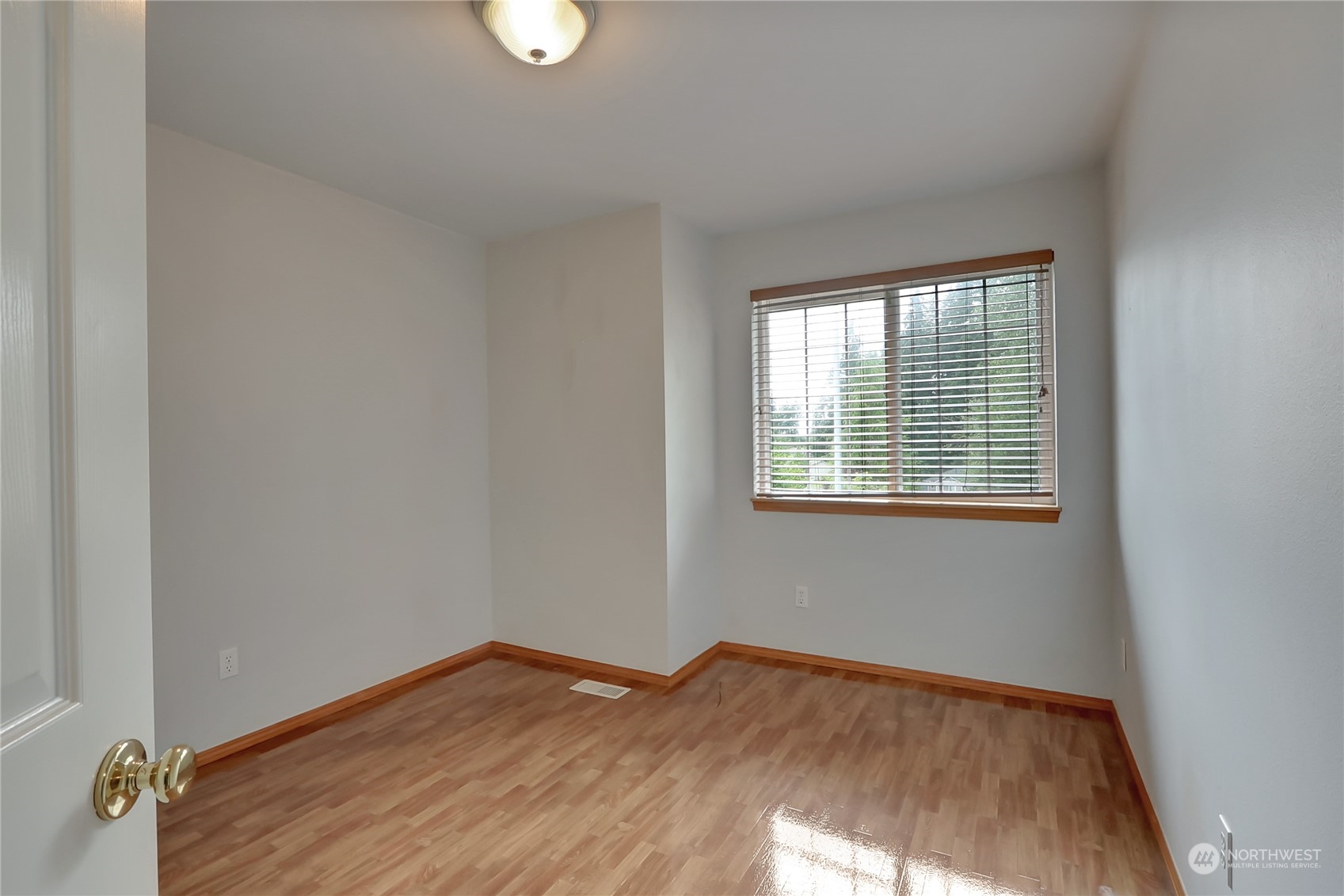 3430 201st Place Southeast Bothell, WA 98012 - Photo 24 of 32 a view of a room with wooden floor and windows