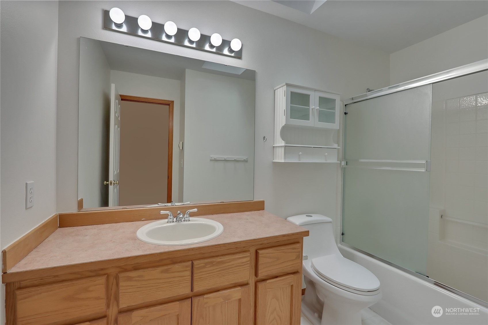 3430 201st Place Southeast Bothell, WA 98012 - Photo 25 of 32 a bathroom with a sink toilet a mirror and shower