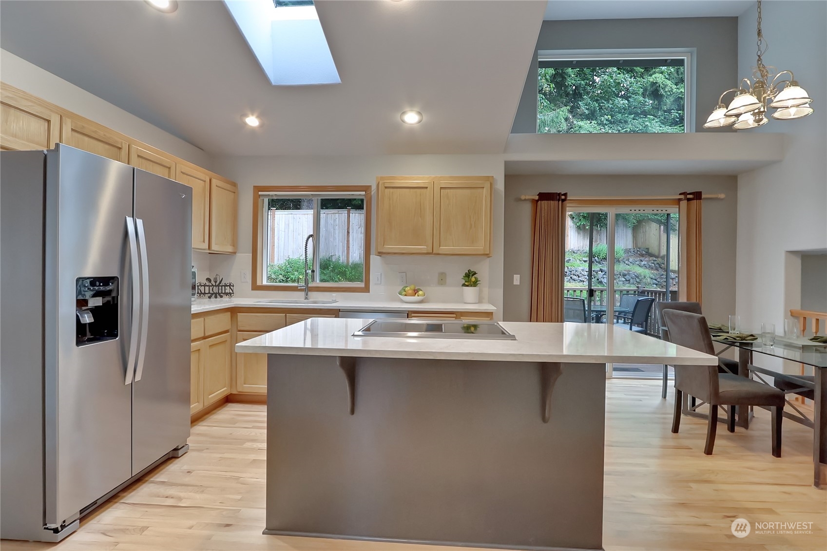 3430 201st Place Southeast Bothell, WA 98012 - Photo 8 of 32 a kitchen with stainless steel appliances granite countertop a sink stove and refrigerator