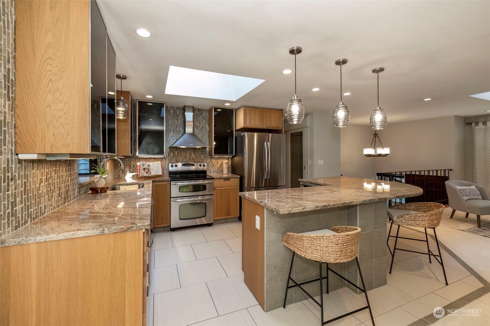 5695 Southwest 44th Street Port Orchard, WA 98367 - Photo 11 of 40 a kitchen with a sink a counter top stainless steel appliances and cabinets