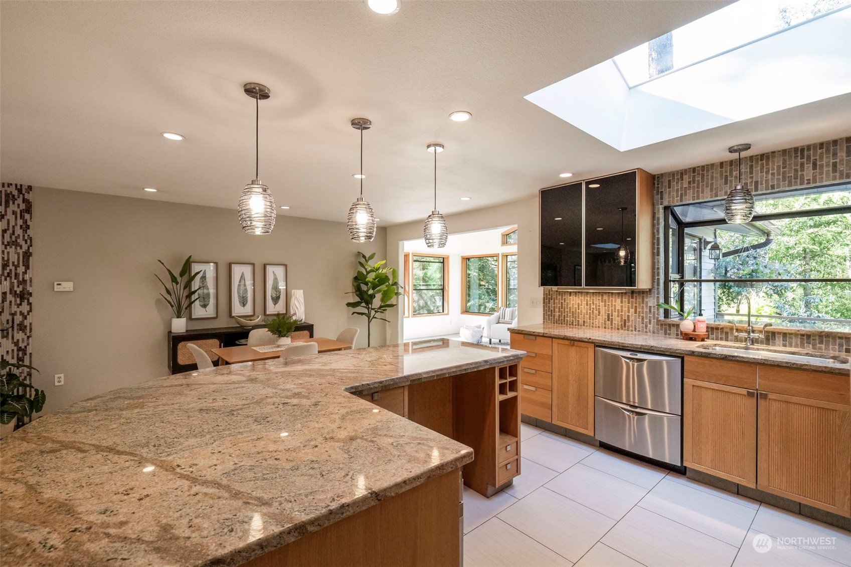 5695 Southwest 44th Street Port Orchard, WA 98367 - Photo 14 of 40 a large kitchen with lots of counter space and a sink