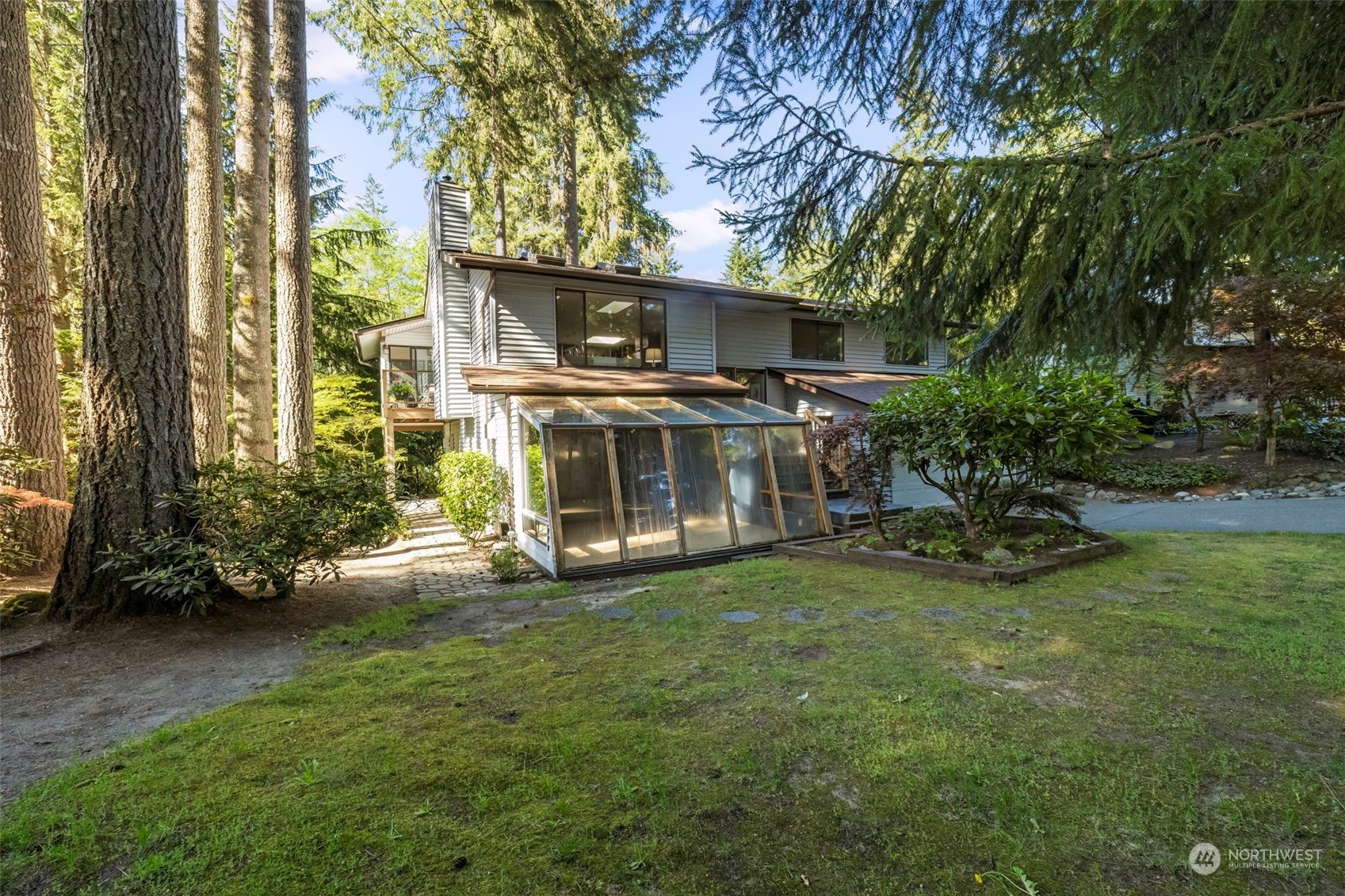 5695 Southwest 44th Street Port Orchard, WA 98367 - Photo 2 of 40 a view of a house with backyard and sitting area