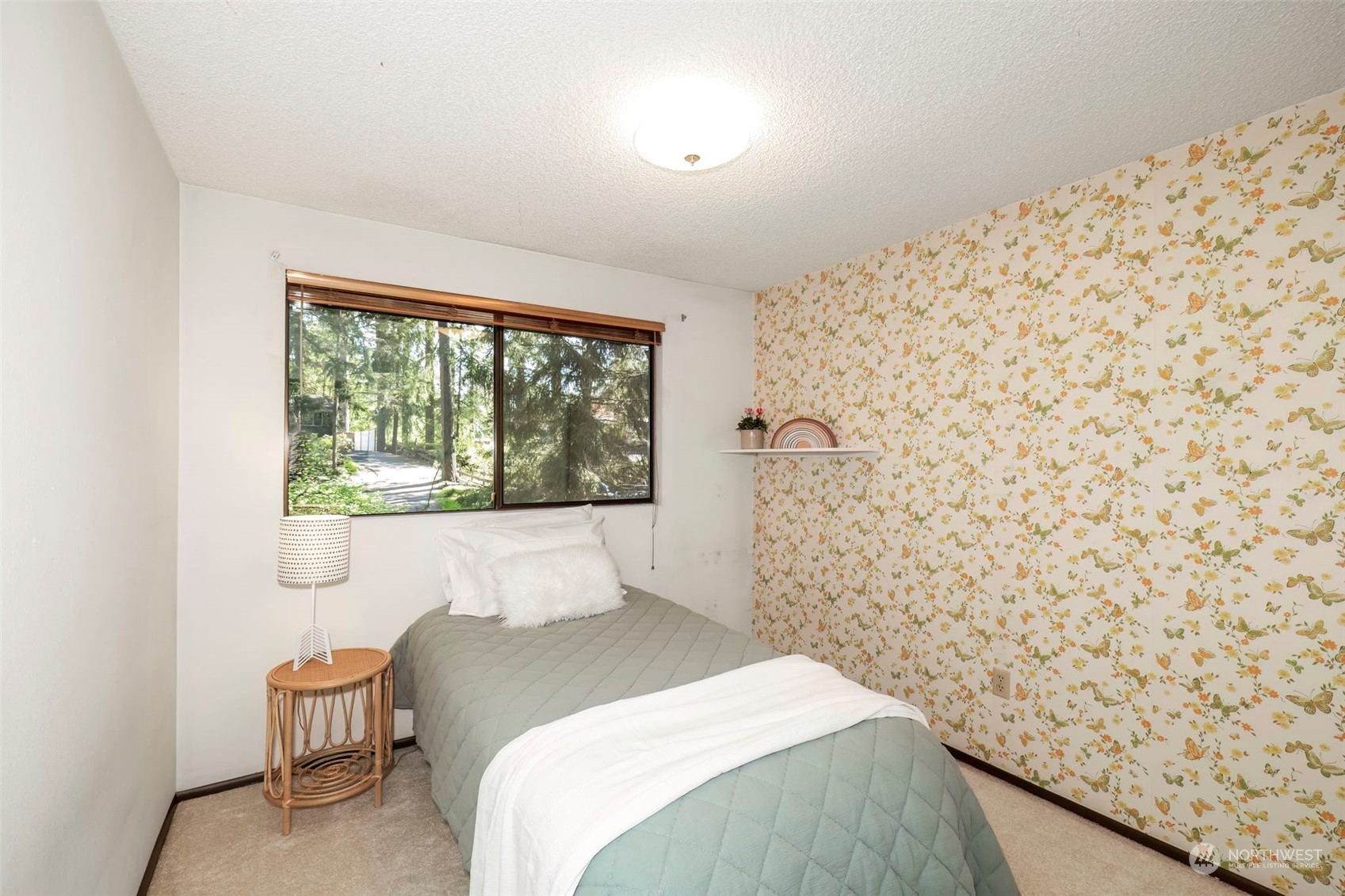 5695 Southwest 44th Street Port Orchard, WA 98367 - Photo 22 of 40 a bedroom with a bed and a window