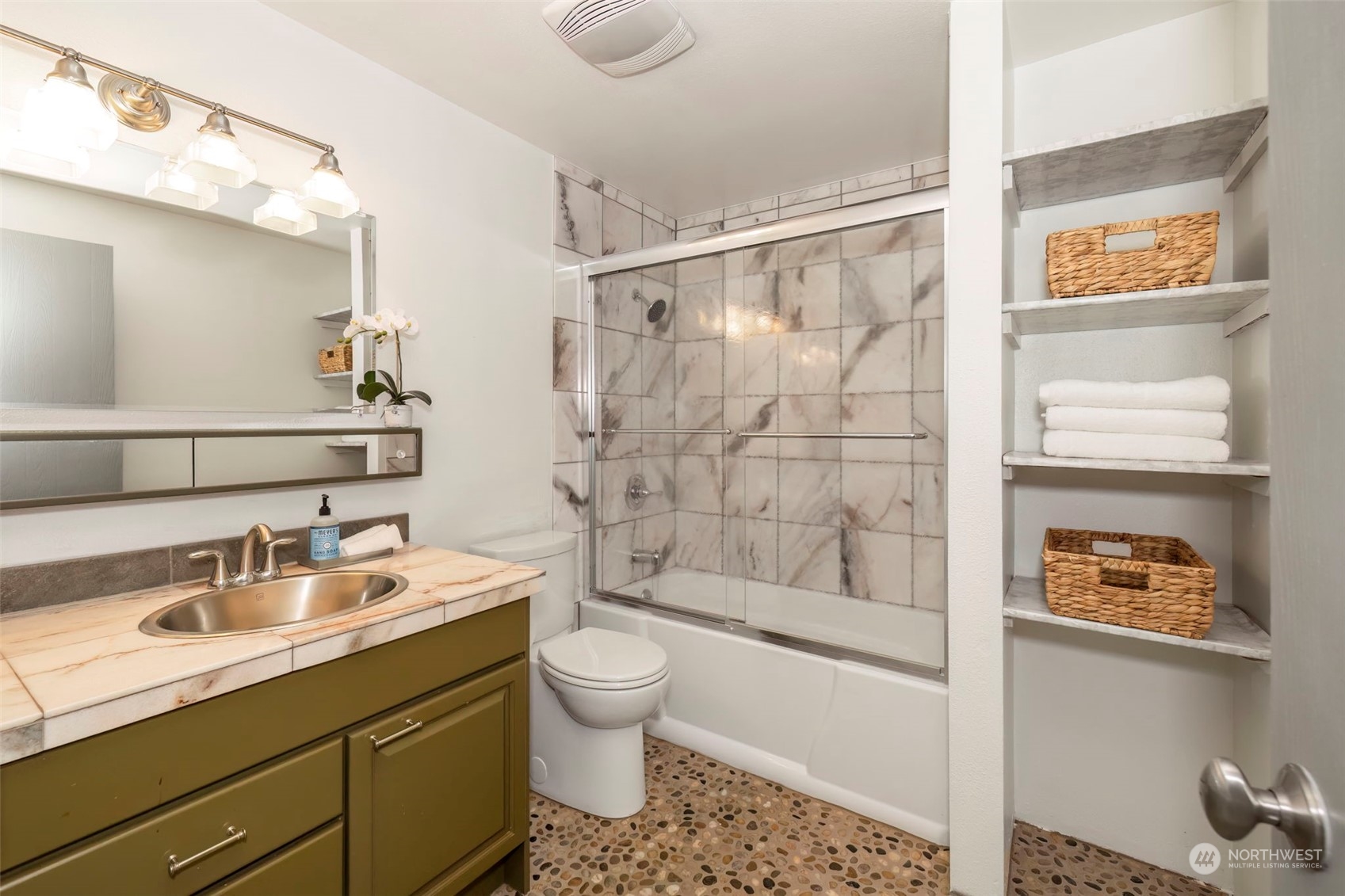 5695 Southwest 44th Street Port Orchard, WA 98367 - Photo 26 of 40 a bathroom with a sink a toilet and shower