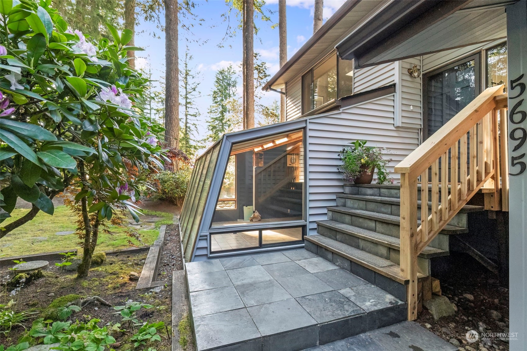 5695 Southwest 44th Street Port Orchard, WA 98367 - Photo 3 of 40 a view of outdoor space with deck and tree