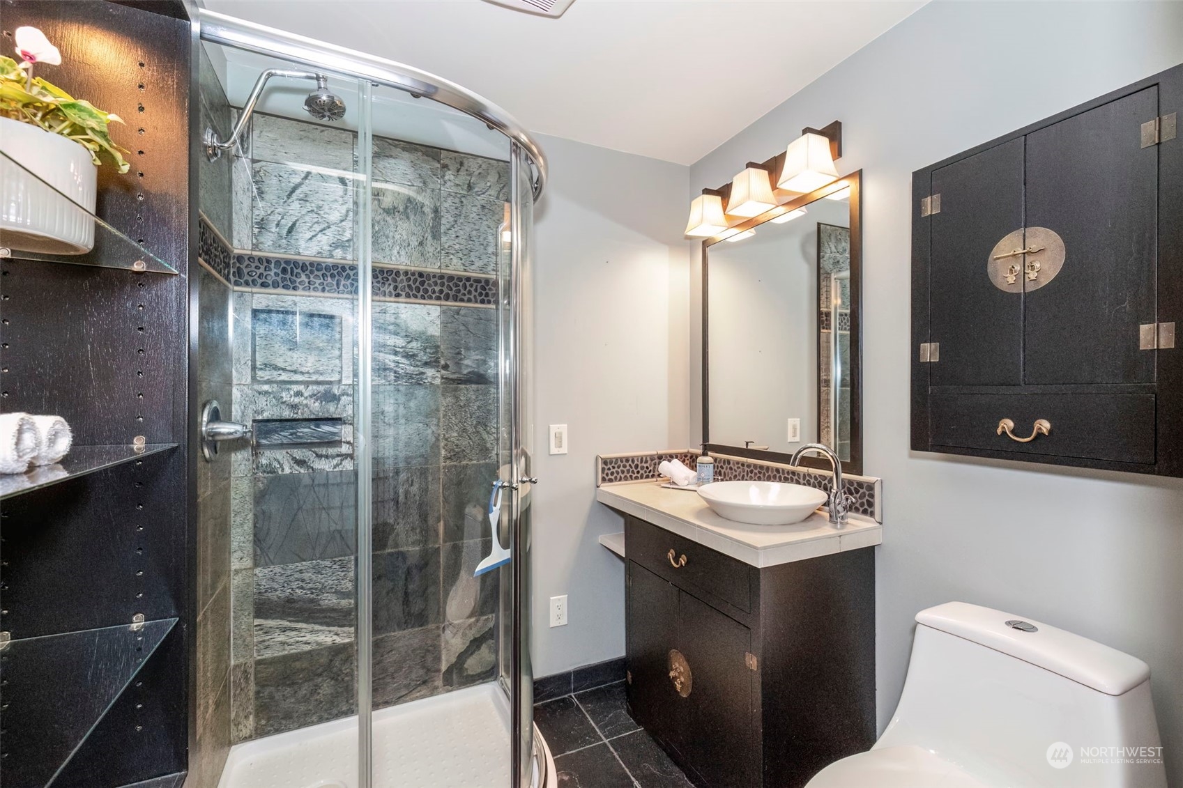 5695 Southwest 44th Street Port Orchard, WA 98367 - Photo 35 of 40 a bathroom with a sink a toilet and shower