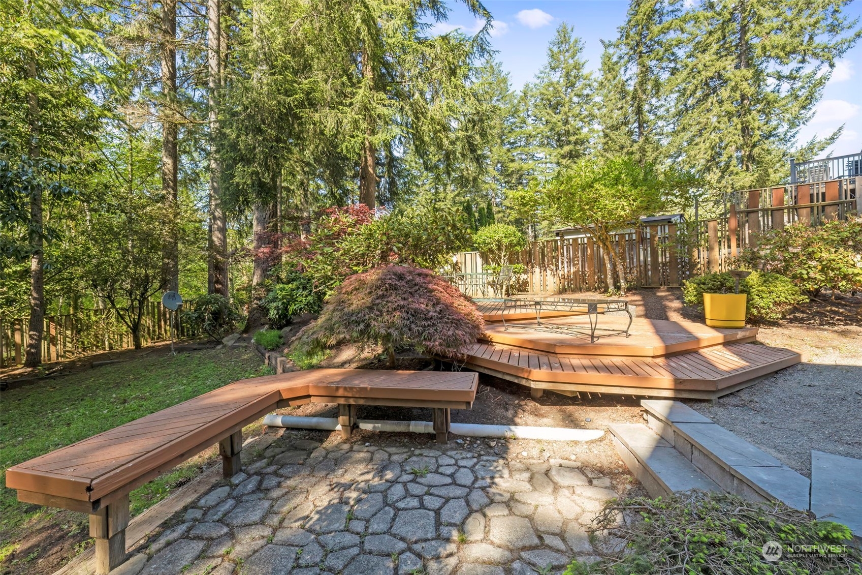 5695 Southwest 44th Street Port Orchard, WA 98367 - Photo 38 of 40 a backyard of a house with outdoor seating