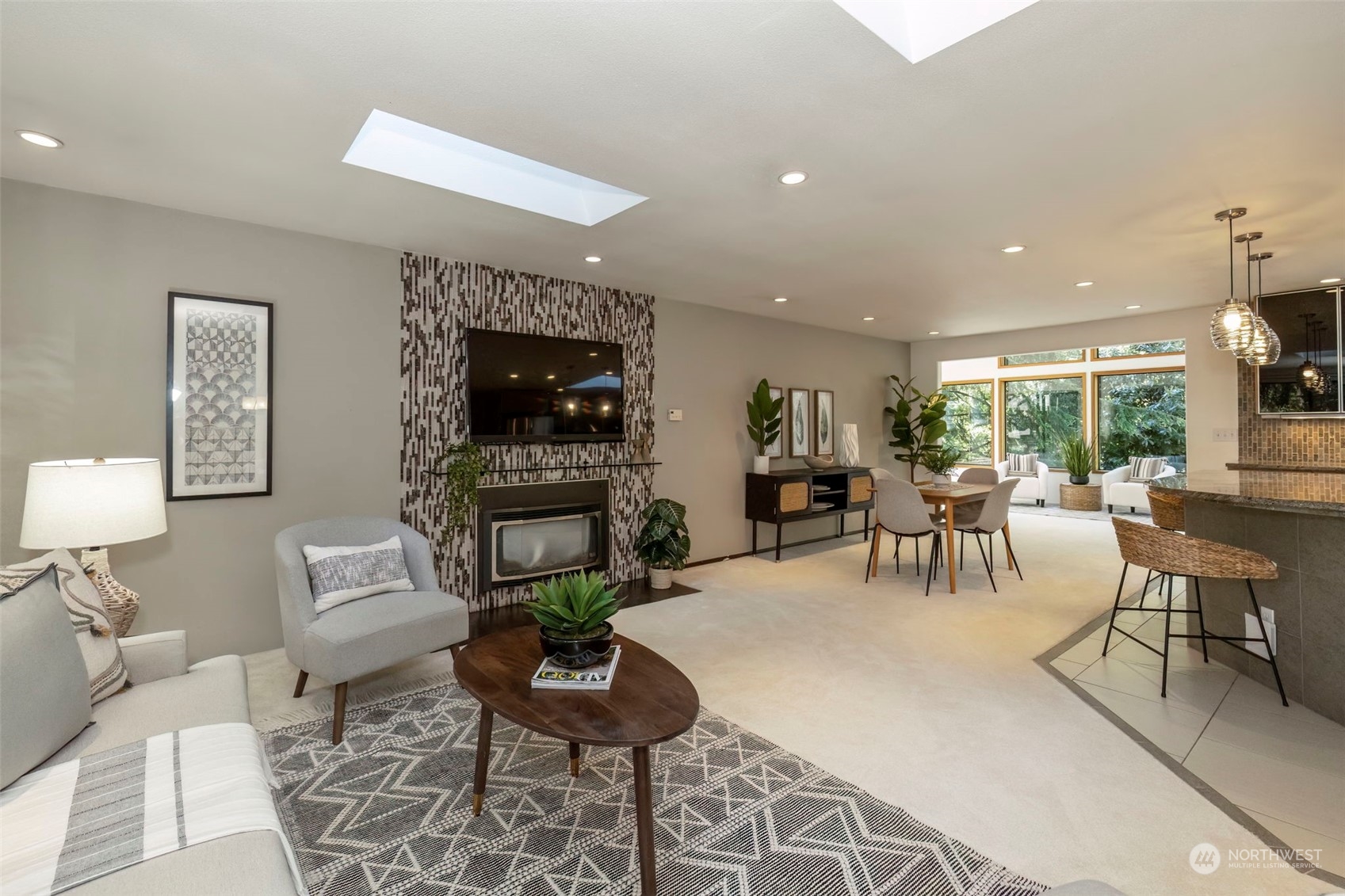 5695 Southwest 44th Street Port Orchard, WA 98367 - Photo 5 of 40 a living room with fireplace furniture and a flat screen tv