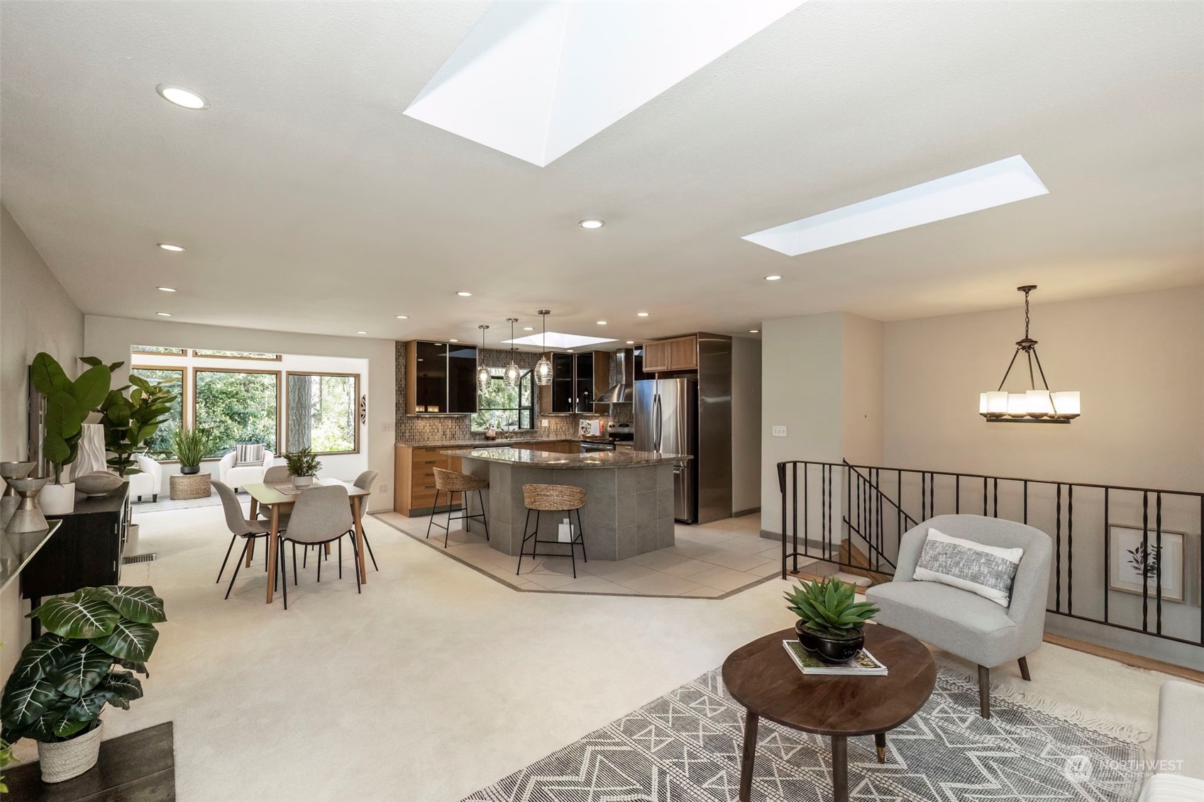 5695 Southwest 44th Street Port Orchard, WA 98367 - Photo 6 of 40 a living room with furniture and a dining room with kitchen view