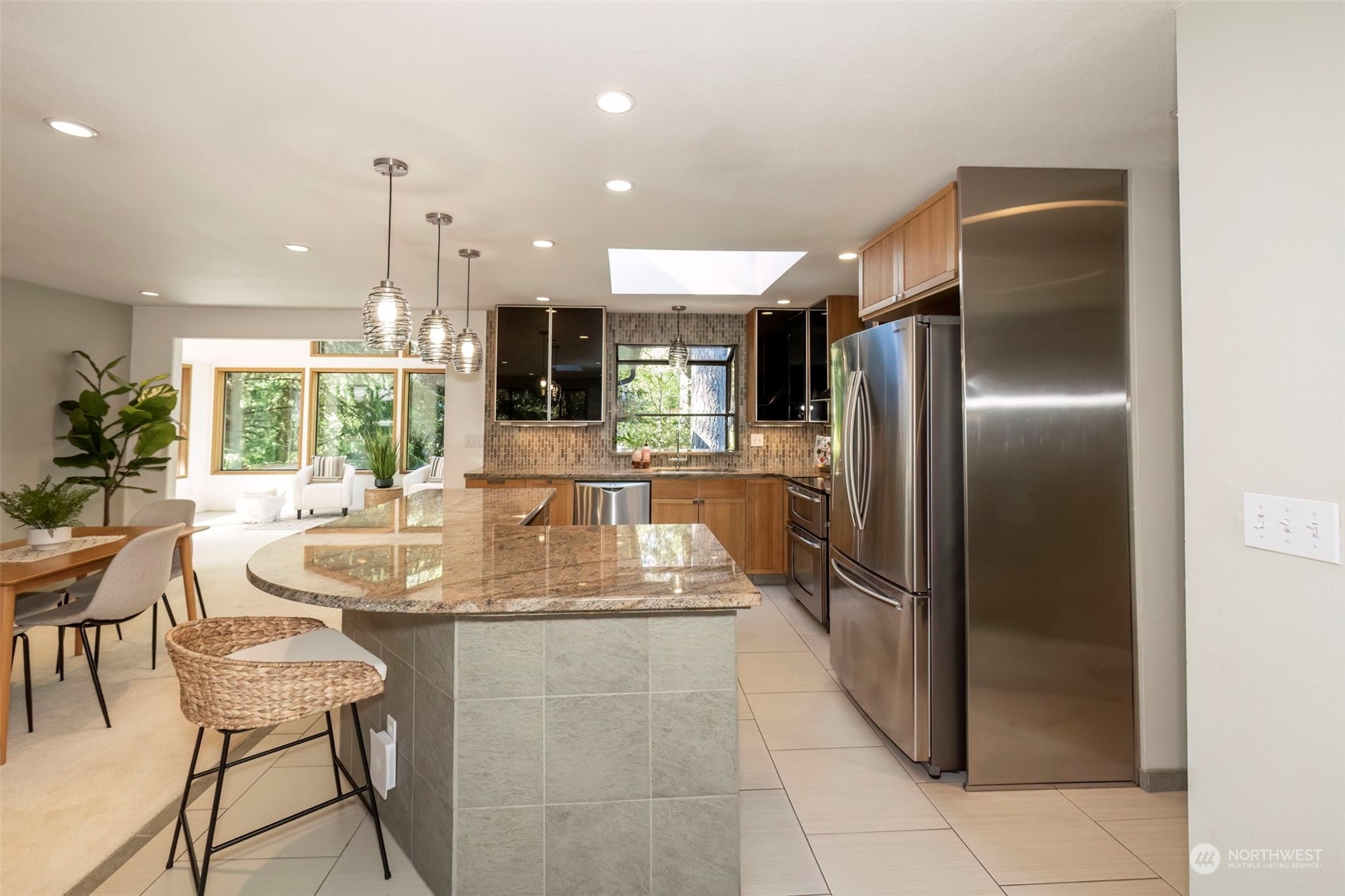 5695 Southwest 44th Street Port Orchard, WA 98367 - Photo 9 of 40 a kitchen with stainless steel appliances granite countertop a refrigerator and a sink