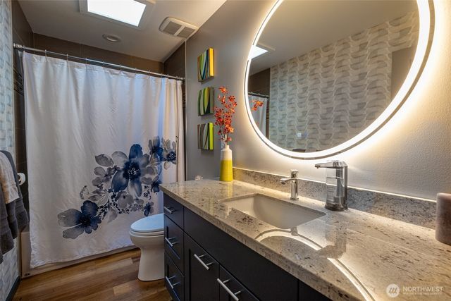 a bathroom with a sink and a mirror