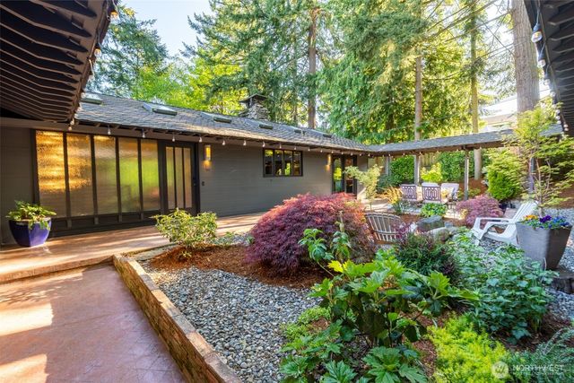 a view of a chairs and table in the patio