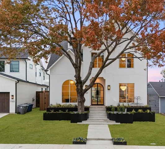 a front view of a house with a yard