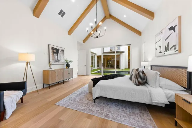 a bedroom with a bed couch and window