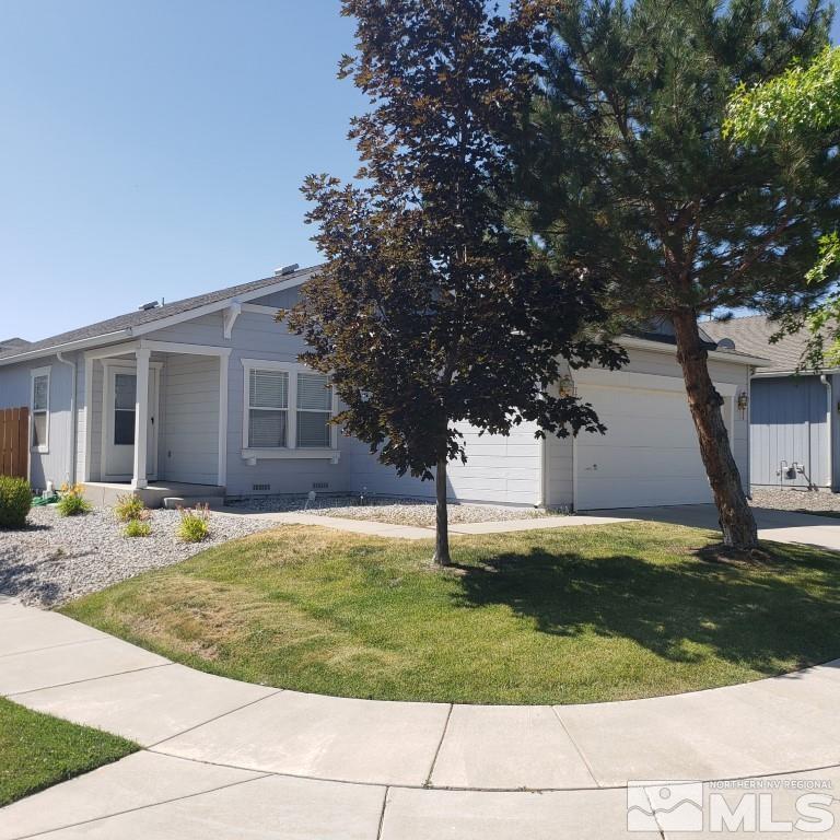 7752 Tulear Street Reno, NV 89506 - Photo 1 of 21 a view of a yard in front of a house