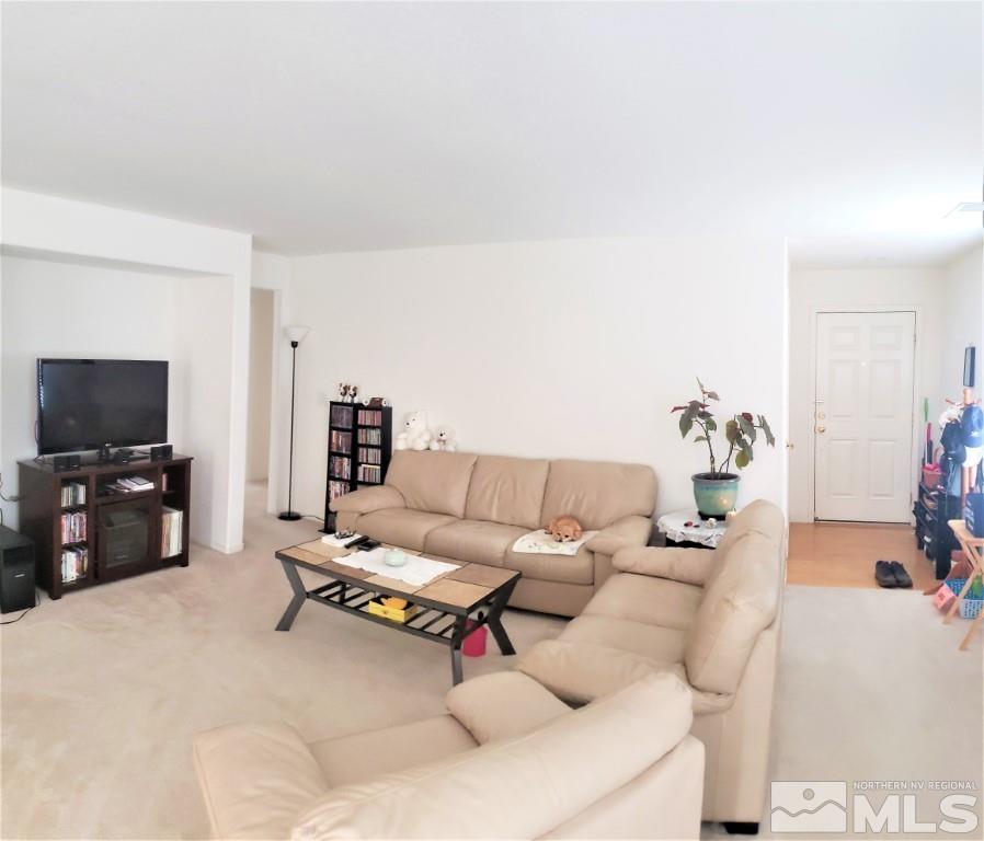 7752 Tulear Street Reno, NV 89506 - Photo 7 of 21 a living room with furniture and a flat screen tv