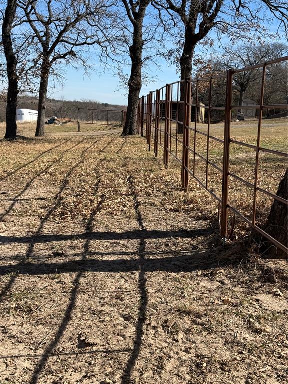 1072 3 Skillet Road Springtown, TX 76082 - Photo 5 of 12 a view of a yard with wooden fence
