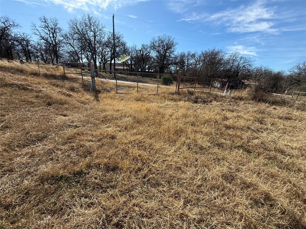 1072 3 Skillet Road Springtown, TX 76082 - Photo 8 of 12 a view of a lake with houses