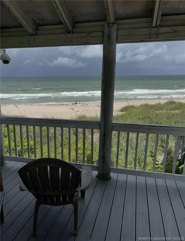 a balcony with wooden floor