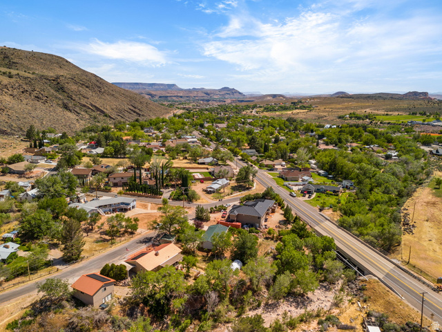 55 Spring Drive Toquerville, UT 84774 - Photo 29 of 36 Aerial perspective of suburban area featuring a mountainous background