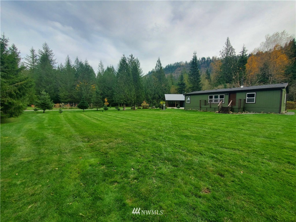 6851 South Pass Road Maple Falls, WA 98266 - Photo 1 of 34 a view of a green field with sitting area