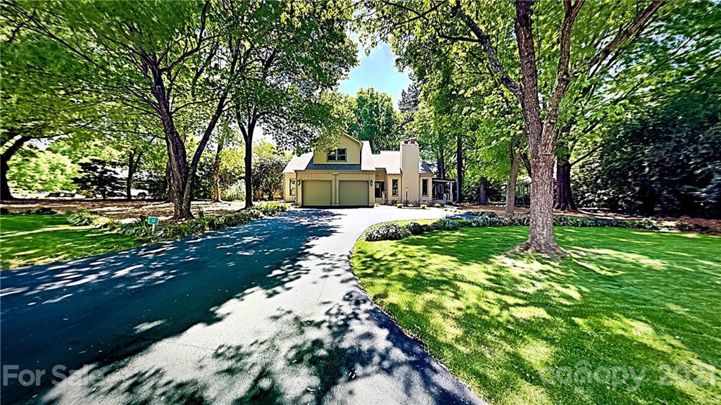 12 Duckhook Circle Lake Wylie, SC 29710 - Photo 1 of 30 a view of a house with a big yard and large trees