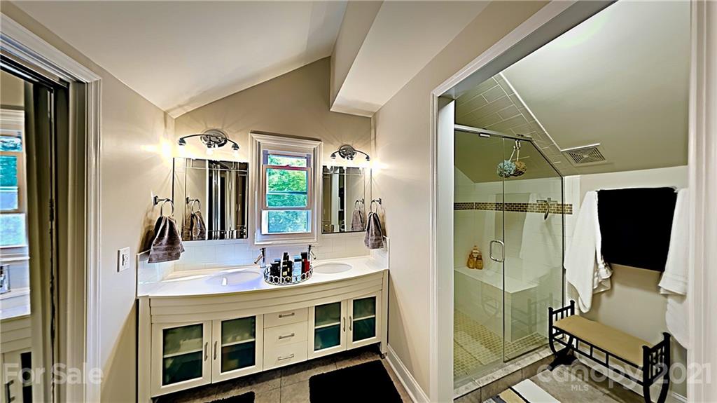 12 Duckhook Circle Lake Wylie, SC 29710 - Photo 19 of 30 a bathroom with a double vanity sink a mirror and shower