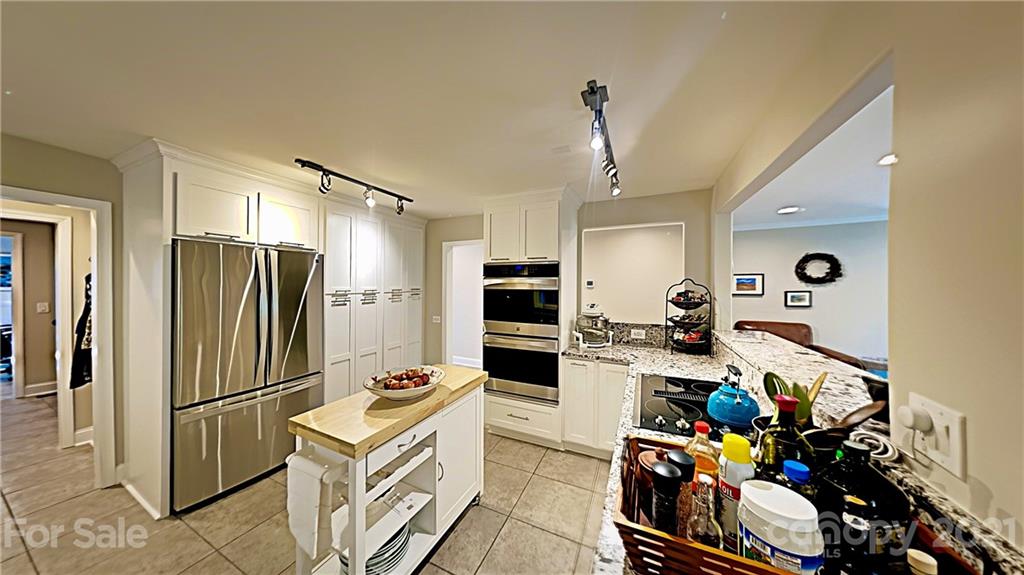 12 Duckhook Circle Lake Wylie, SC 29710 - Photo 5 of 30 a kitchen with refrigerator and cabinets