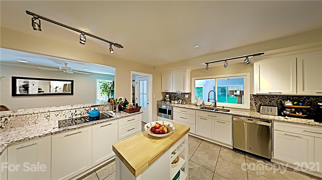 12 Duckhook Circle Lake Wylie, SC 29710 - Photo 6 of 30 a kitchen with stainless steel appliances granite countertop a sink and cabinets