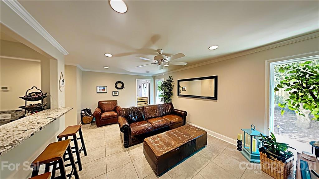12 Duckhook Circle Lake Wylie, SC 29710 - Photo 8 of 30 a living room with furniture and a chandelier