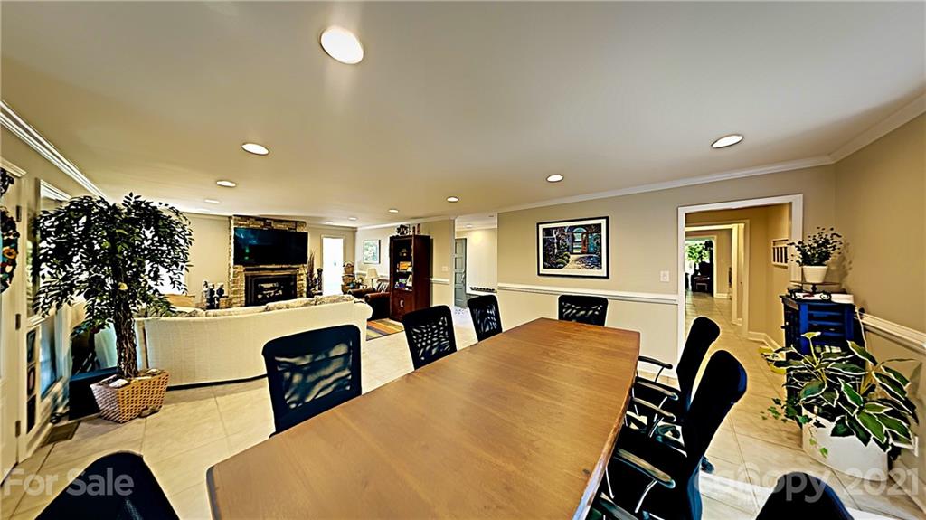 12 Duckhook Circle Lake Wylie, SC 29710 - Photo 9 of 30 a view of a dining room with furniture and a flat screen tv