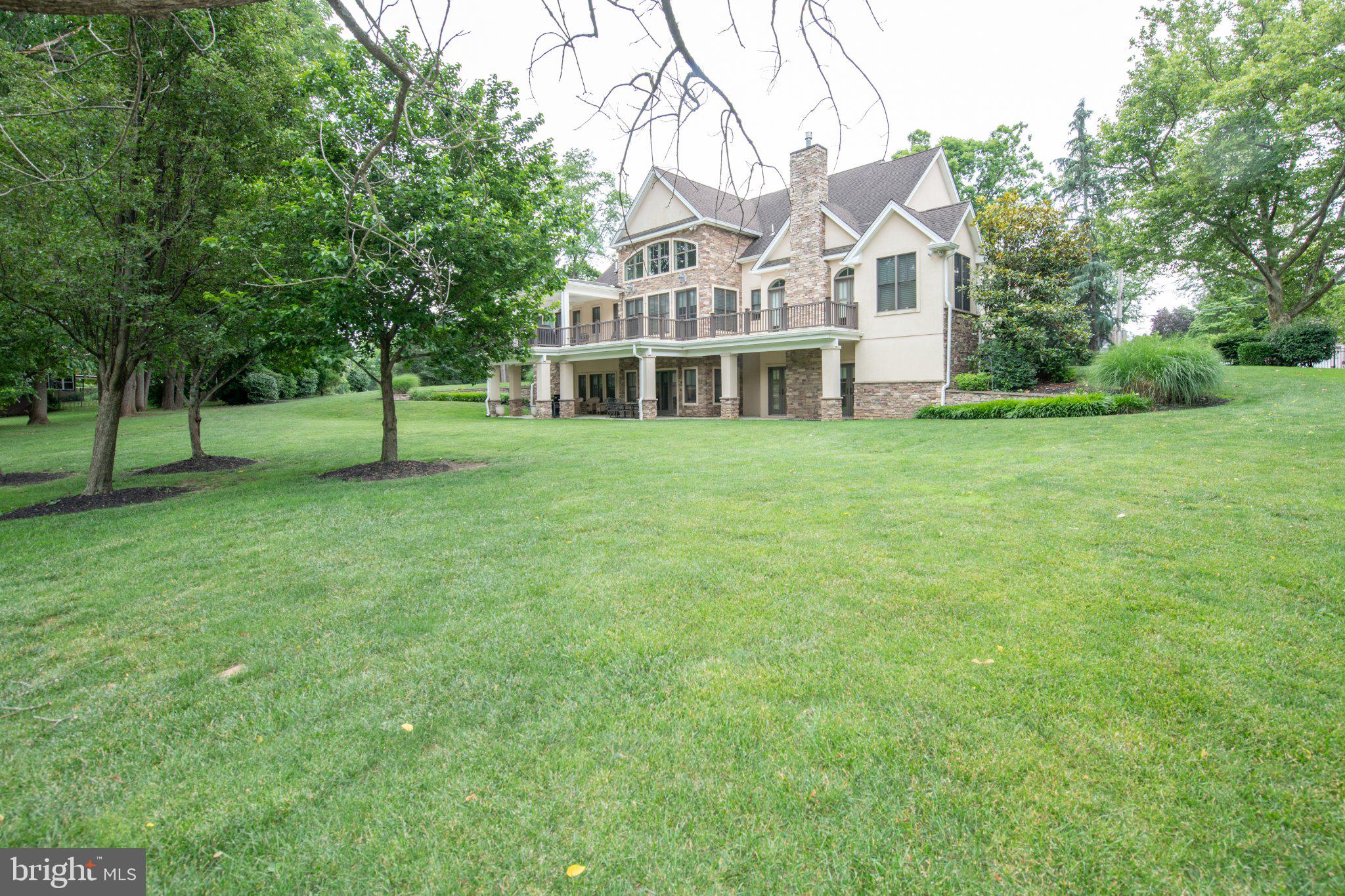 711 Moredon Road Jenkintown, PA 19046 - Photo 14 of 140 Elegant home amidst lush greenery.