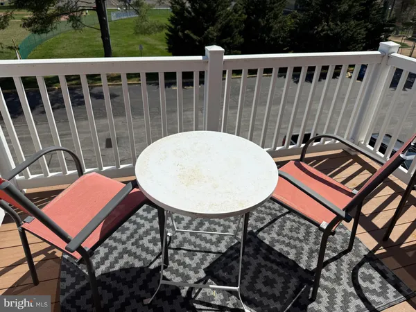 a view of a chairs and table in the patio