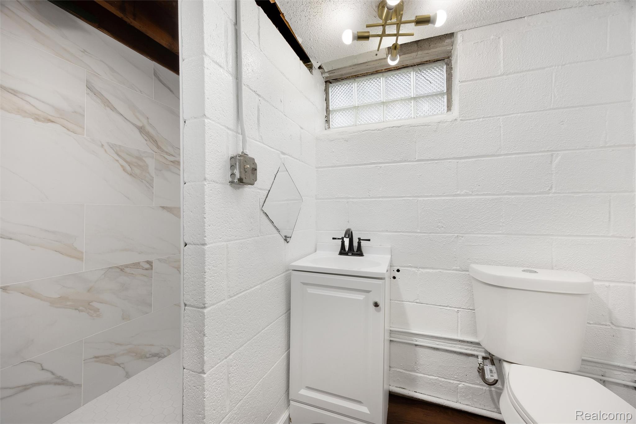 11566 Nottingham Road Detroit, MI 48224 - Photo 21 of 23 White ceramic tile shower with veined pattern