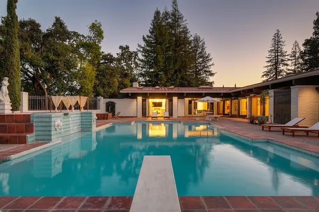 a view of a chairs and table in a patio
