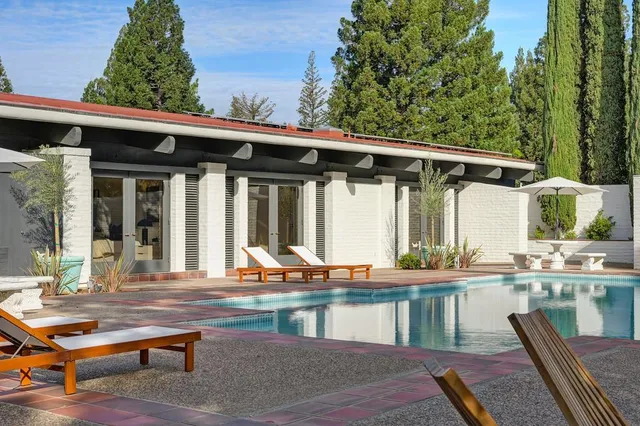 a view of a living room and dining room