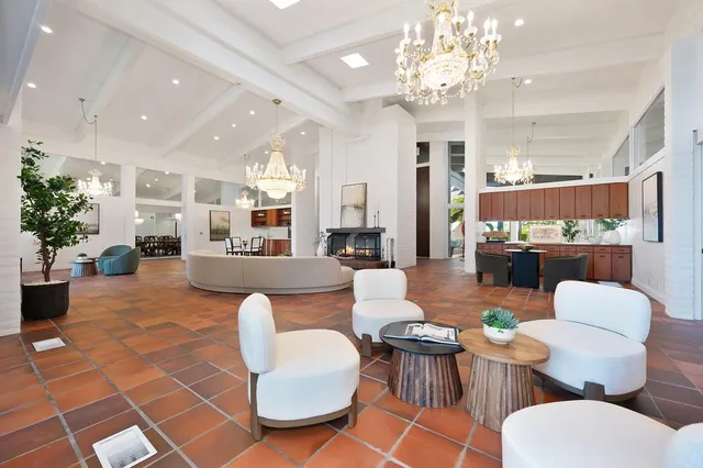 a view of a dining room with furniture and window