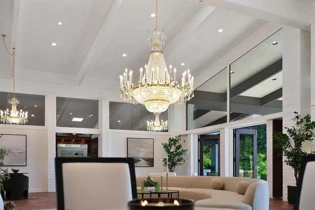 a living room with fireplace furniture and a table