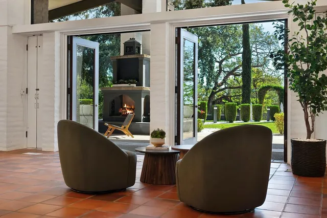 a kitchen with stainless steel appliances kitchen island granite countertop a sink and cabinets