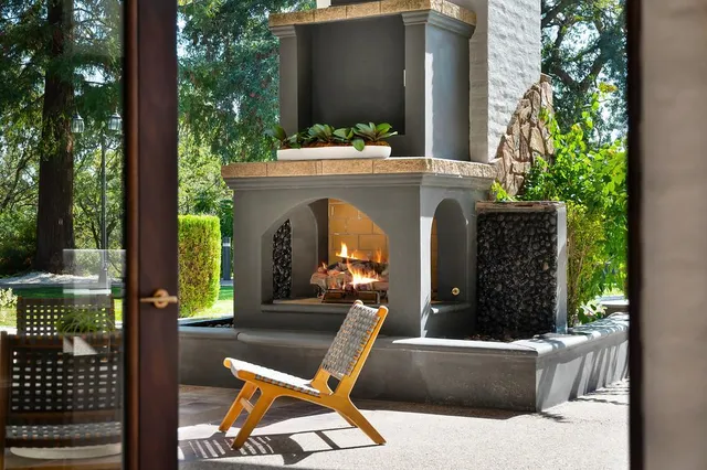 a spacious bedroom with a bed and a chandelier