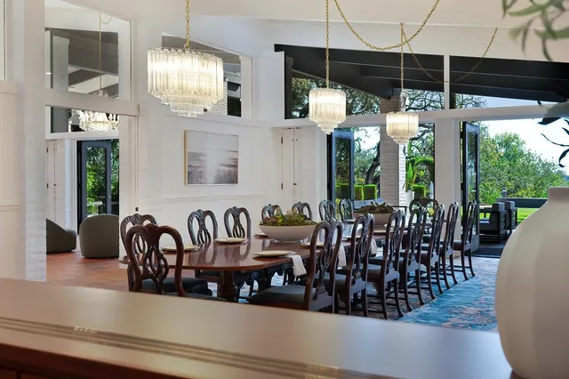 a bedroom with a large bed and a couch