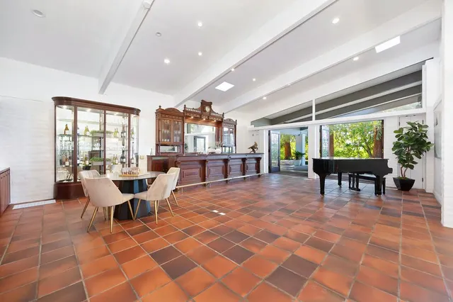 a bedroom with a large bed and a large window