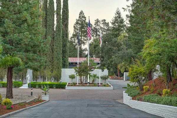 a view of a wooden floor in a backyard of a house