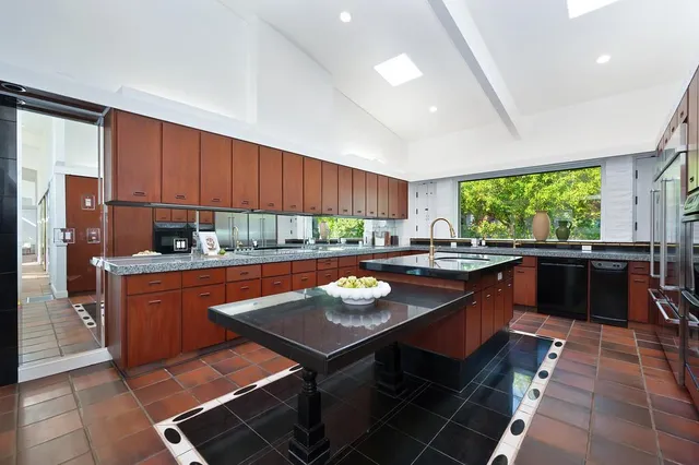 a very nice looking room with a large mirror and shower