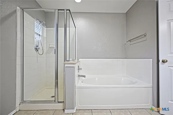 a bathroom with a sink a mirror and a bathtub