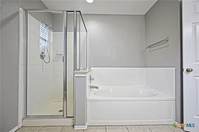 a bathroom with a sink a mirror and a bathtub