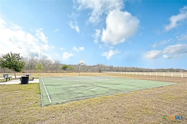 a view of a lake with houses in the back