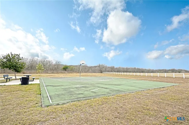 a view of a lake with houses in the back